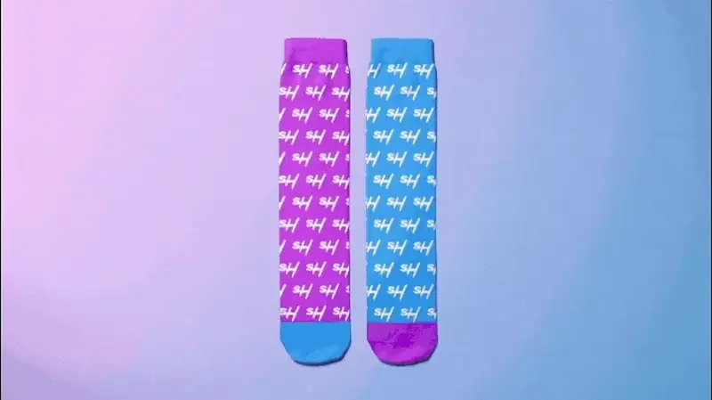 Colorful socks in purple and blue with stylish patterns, perfect for adding flair to any outfit.