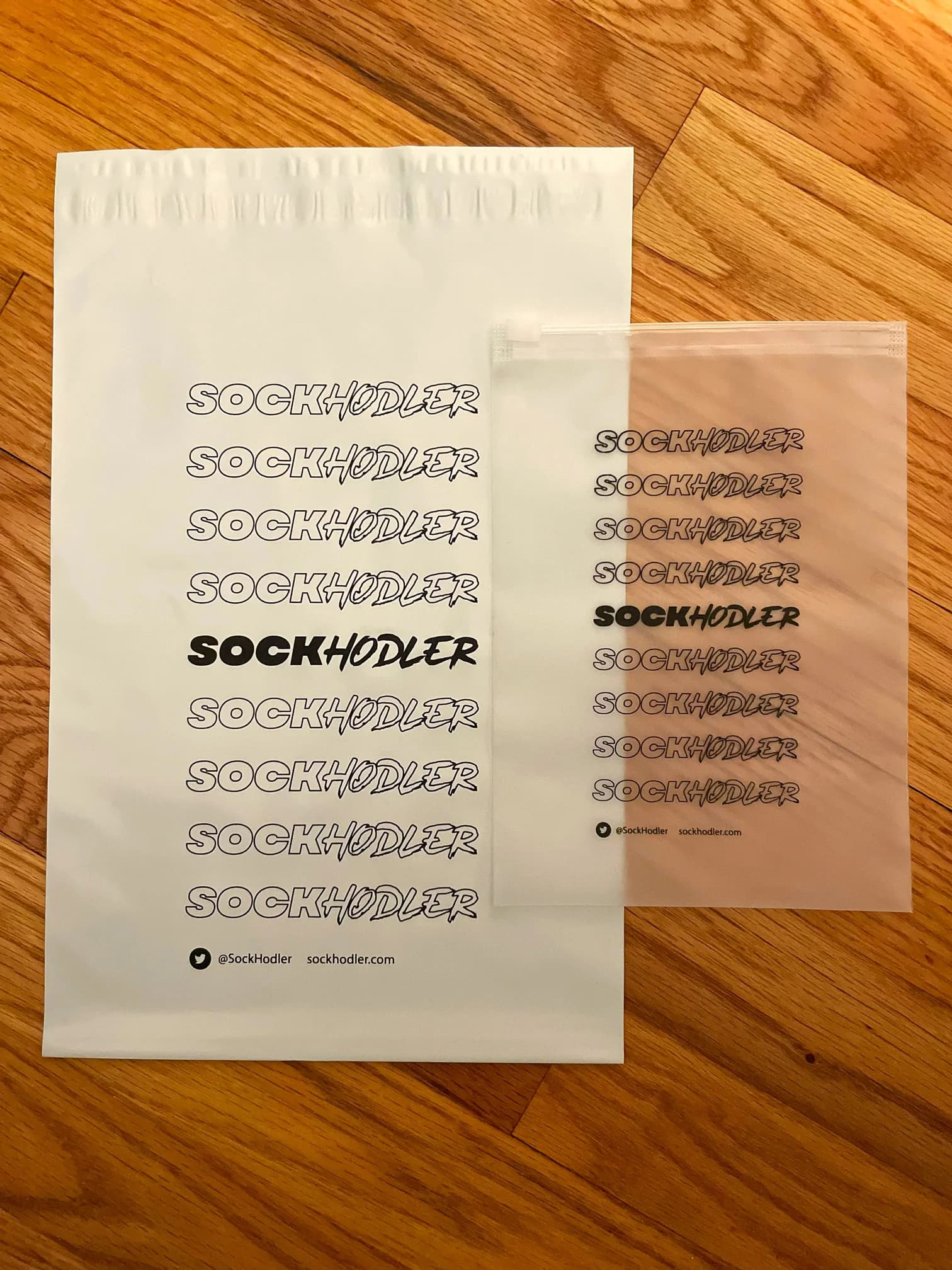 SockHodler packaging and pouch displaying brand name in repeated text.