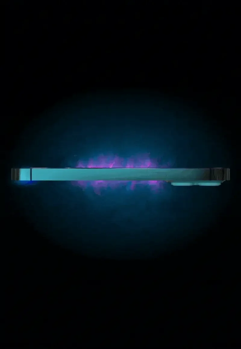 A digital device illuminated with a blue and purple glow against a dark background.