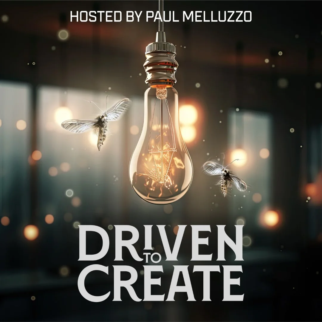 Light bulb with moths hovering around it in a dimly lit setting.