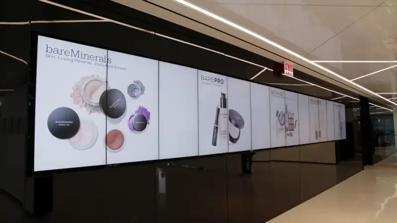 Display showcasing bareMinerals makeup products in a modern setting.