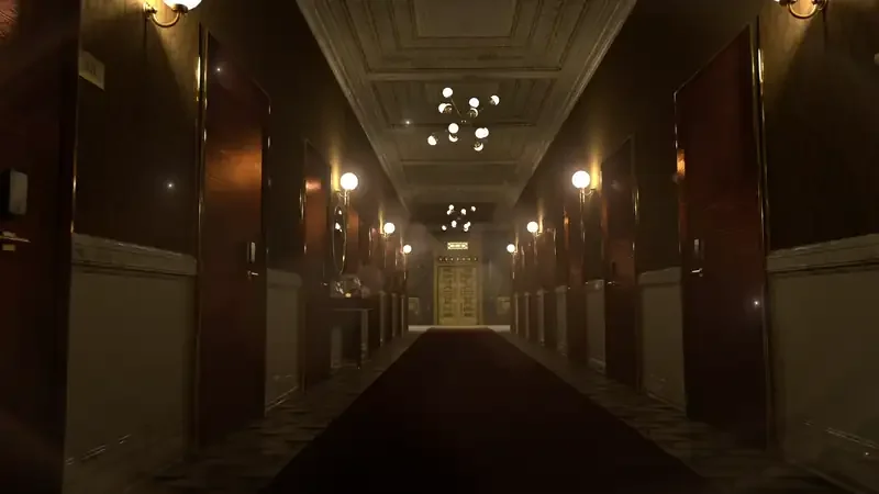 Dimly lit hotel corridor with ornate ceilings and wooden doors, creating an eerie atmosphere.