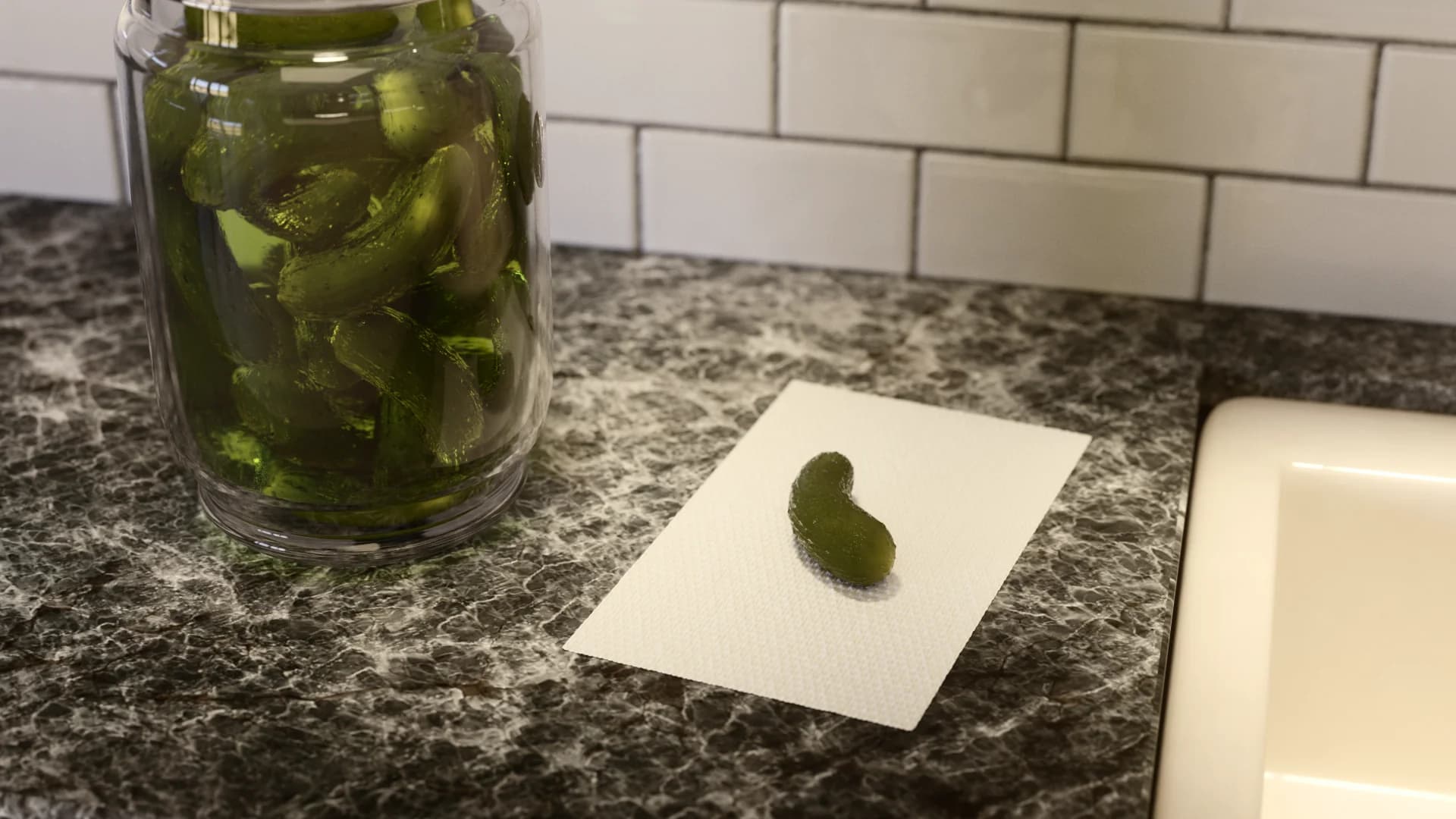 Close-up of pickles in a jar on a kitchen countertop with a pickle on a paper towel.